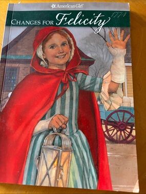 American Girl Book Featuring Girl in Red Cape and Green Striped Dress